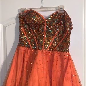 Short orange and blue sequined homecoming dress